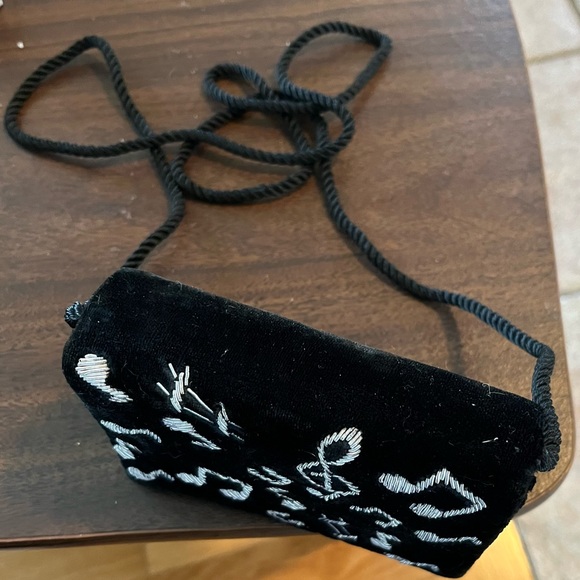 Small purse with music design. ‘Strap’ is 24 inches from shoulder to purse. - Picture 3 of 5